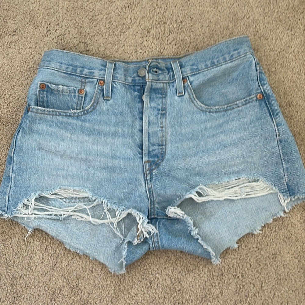 Distressed Levi's light wash denim shorts